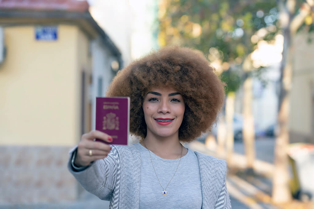 woman holding Spain Visa - Things to Do Before Moving to Spain